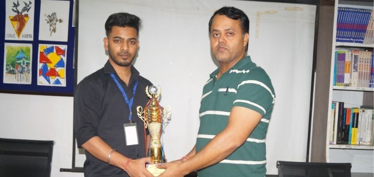 Ravi Sir giving award to Sumit Walia